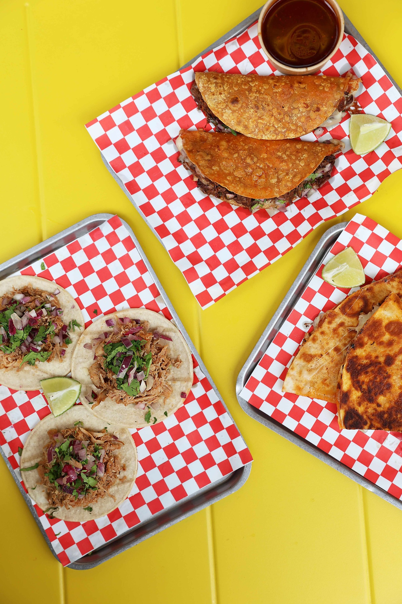 Tacos, birria and quesa side by side
