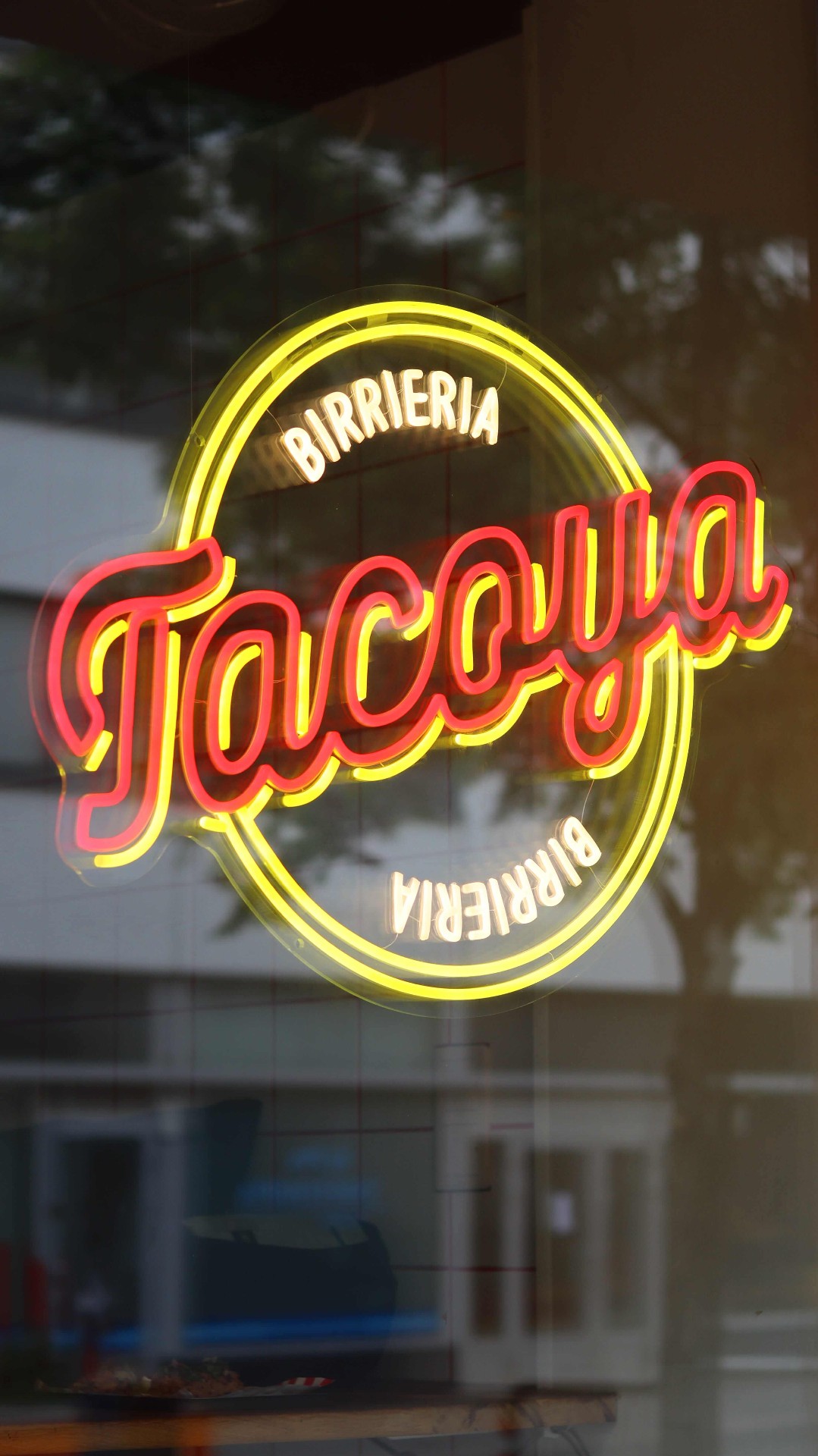 Birrieria glow in the window